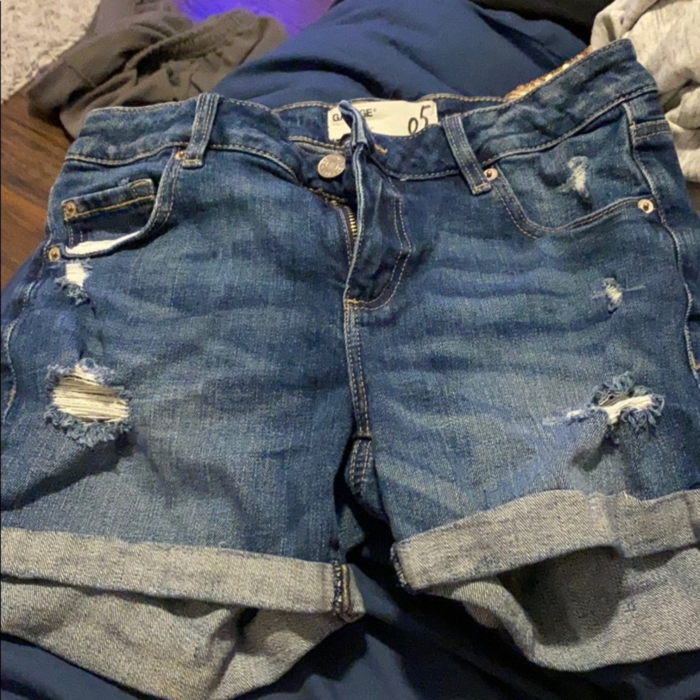 Dark wash jean shorts.